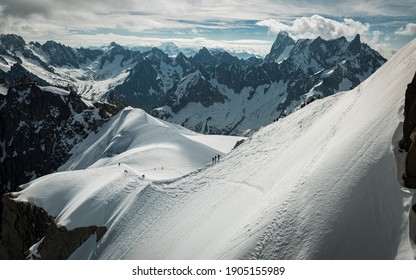 People Climbing Through Glacier And Mountains