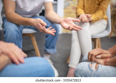 People. Close Up Picture Of People Sitting In A Cirlce