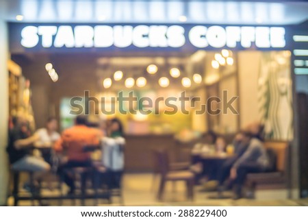 People in Coffee shop blur background with bokeh lights, vintage filter, blurred  of star buck cafeteria coffee 