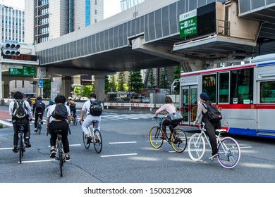 People Commuting By Bicycle In Tokyo