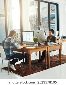 People, computer or typing in office for creativity, market research or storytelling at creative agency. Team, diversity or tech screen at table for SEO, brainstorming or proofreading article in city