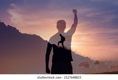 People conquering adversity, strong young motivated man climbing up a mountain setting goal to reach the top.  - Shutterstock ID 2127648815