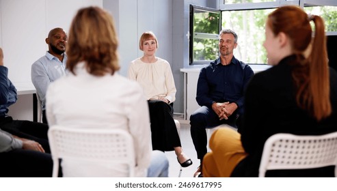 People Consoling Man In Group Therapy Session - Powered by Shutterstock