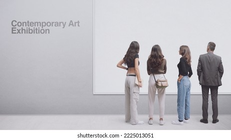 People at the contemporary art exhibition, they are looking at one artwork, blank copy space