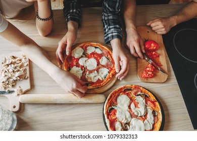 People Cooking Food. Friends Cooking Homemade Pizza Together, Top View. Culinary, Togetherness, Friendship Concept