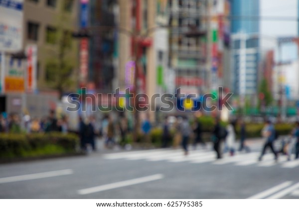 people crossing at a\
pedestrian crossing