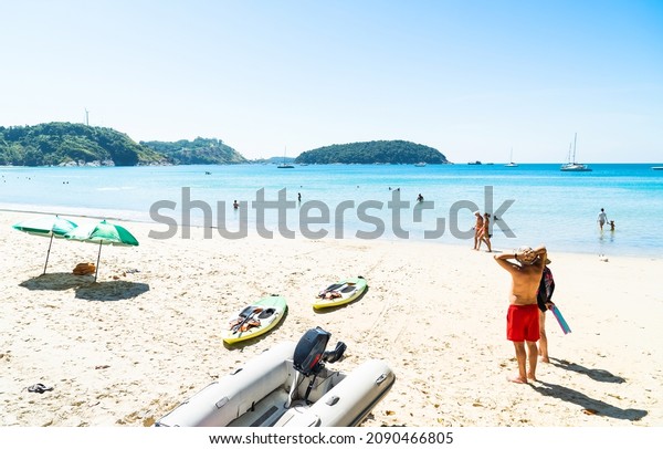 People crowd relax in holiday  travel\
trips vacation. Nai harn beach\
Phuket,Thailand.