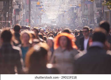 People Crowd Walking On Busy Street On Daytime