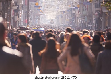 People Crowd Walking On Busy Street On Daytime