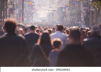 people crowd walking on busy street on daytime
