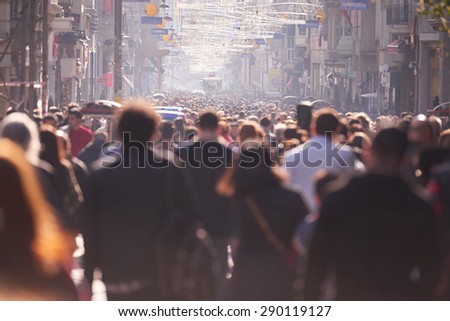 people crowd walking on busy street on daytime