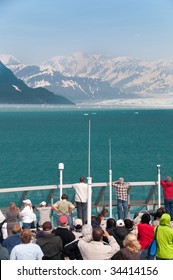 People At A Cruise Ship Looking At The Scenery At Hubbard Glacier, Alaska