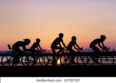 People cycling at beach on twilight time in Thailand Asia - Powered by Shutterstock