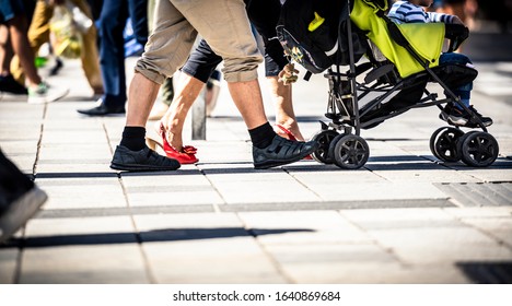 People Cycling And Walking On Sidewalk 