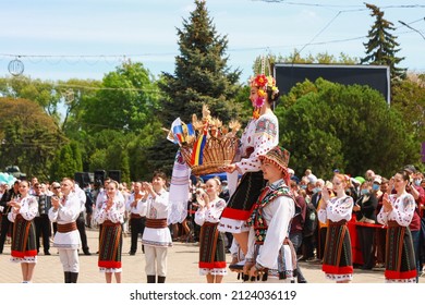 People dance and have fun in traditional national authentic costumes. Parade and celebration of the City Day on May 22, 2021 Balti Moldova.