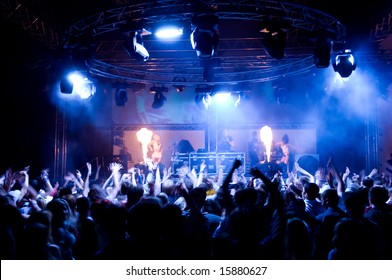People dancing at the concert, fire show and music - Shutterstock ID 15880627