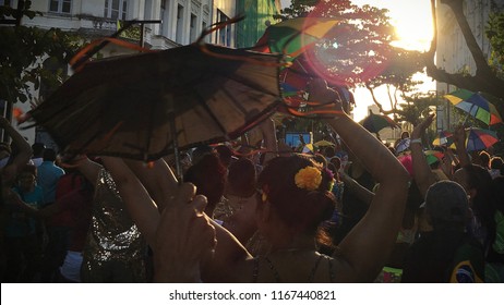 People dancing with a frevo umbrella.Popular culture. Carnival of Recife. Pernambuco, Brazil. 