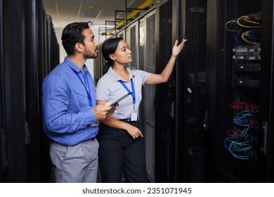 People, data center and engineering teamwork, inspection and cybersecurity, power or backup solution with tablet. Electrician man, woman or manager show or check cables in server room with technology - Powered by Shutterstock