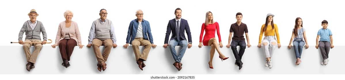 People of different age sitting on a blank panel and looking at camera isolated on white background