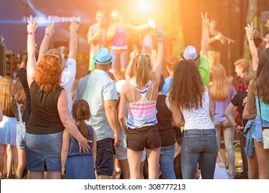 People Of Different Ages Enjoying An Outdoors Music, Culture, Community Event, Festival