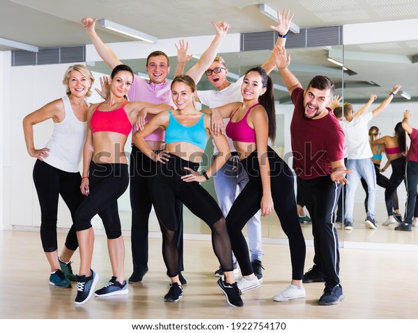 people of\
different ages posing in fitness\
studio