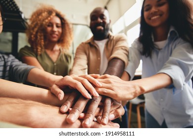 People of different ethnicities uniting to cooperate together - Shutterstock ID 1914958111
