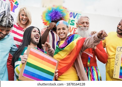 People from different generations have fun at gay pride parade with banner - Lgbt and homosexual love concept - Powered by Shutterstock