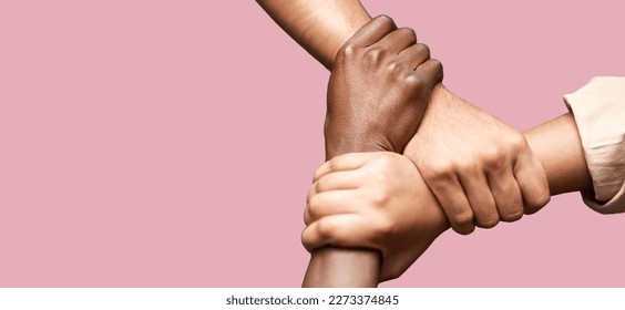 People, diversity and hands together in teamwork collaboration for trust against a pink studio background. Diverse group of friends holding hand in unity, solidarity or community agreement on mockup - Powered by Shutterstock