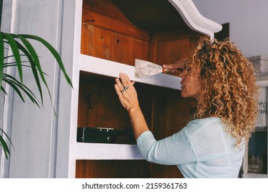 People And Diy Hobby Work At Home Concept Leisure Activity. Adult Woman Working On An Old Furniture Renewing And Restoring. Handmade Work Female People For Sustainability And Circular Economy