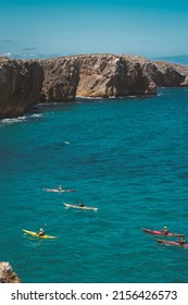 People Doing Kayak In The Beautifull Bay Of Cabo De Peñas In Asturias, Spain