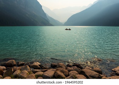 People Doing Kayak In Small Family Group On Lake Louise, Banff National Park, Alberta, Canada. 