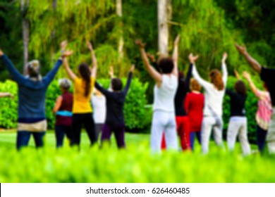 People doing Qi-Gong in the green nature