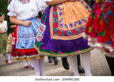 People dressed in Hungarian folk traditional clothes. - Shutterstock ID 2049892385
