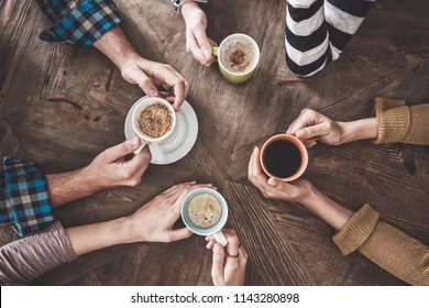 People drinking coffee high angle view - Shutterstock ID 1143280898