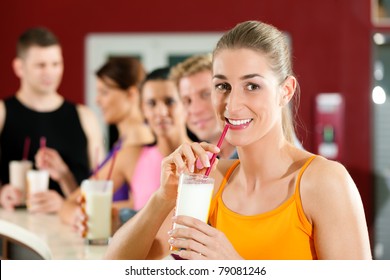 People Drinking Protein Shake After Workout In Gym Or Fitness Club