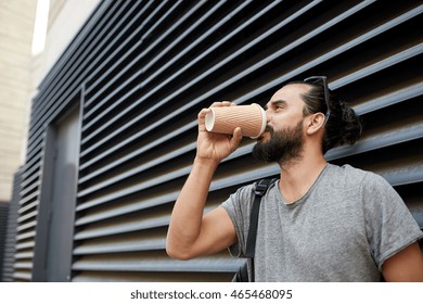 People, Drinks, Leisure And Lifestyle - Man Drinking Coffee From Disposable Paper Cup On City Street