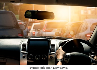 People Driving Inside Car And Many Cars On The Road Jam In Traffic Junction By Red Light Control, Rush Hour In Thailand On Day.