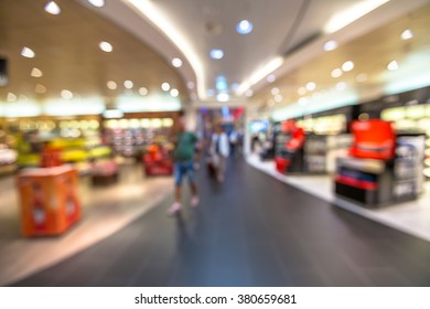People in the duty free shop at the airport. Blur effect. - Shutterstock ID 380659681