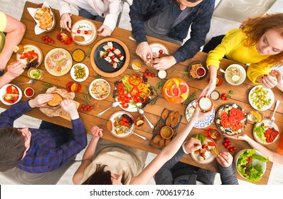 People Eat Healthy Meals At Served Table Dinner Party, Table Top View