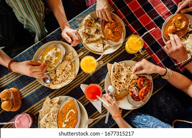 People Eating Colorful Indian Meal, Top View, Hands. Togetherness Concept, Family Concept, Celebration Concept