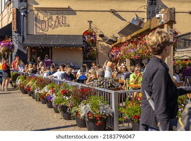 People Are Eating Outdoors In Historic District Of Victoria BC On Sunny Summer Day. Tourists Having Lunch At Street Restaurant. Travel Photo, Selective Focus-July 19,2022-Canada