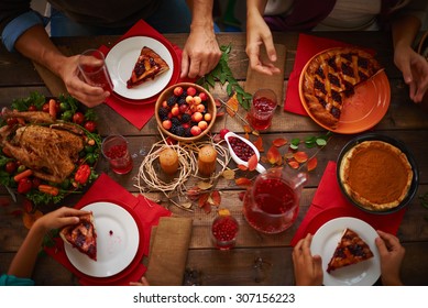 People Eating A Pie And Drinking Cranberry Compote