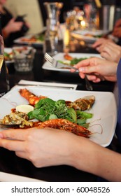 People Are Eating Prawns In A Restaurant