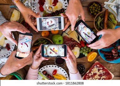 People Eating Together Taking Food Picture With Smartphone To Share On Social Media - Concept Of Celebration - Wooden Table And Mixed Food In Background