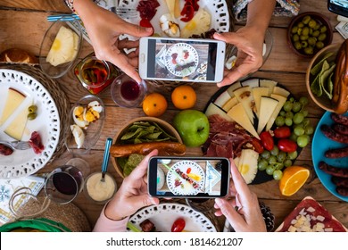 People Eating Together Taking Food Picture With Smartphone To Share On Social Media - Concept Of Celebration - Wooden Table And Mixed Food In Background