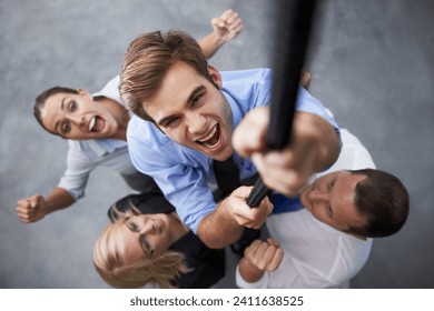 People, energy and corporate man climbing rope for target goals, career development or team building support. Top view, excited cheers and portrait of agent with hard work, determination and ambition - Powered by Shutterstock