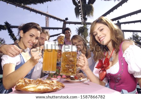 Similar – Image, Stock Photo Young business people on the roof terrace at the Afterwork Beer