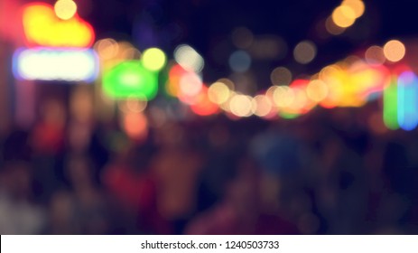 People Enjoying Famous Bourbon Street At Night In The French Quarter Of New Orleans, Louisiana, Blurred