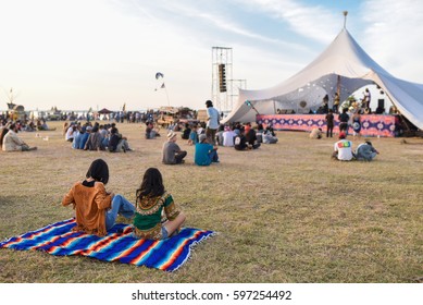 People enjoying music at festival.