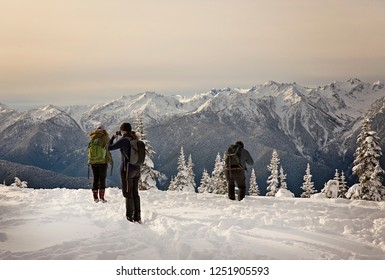 People Enjoying The Snow Covered Mountains In Washington State In The Olympic National Park